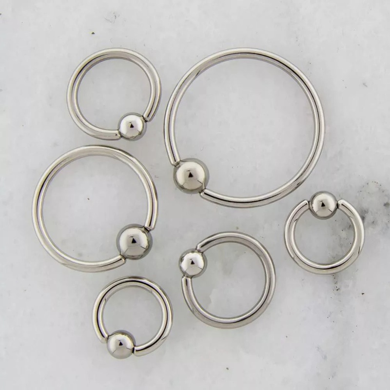 12g Hand Polished Captive Bead Ring – 1 Piece #SPLT#6 12G (2mm) Inner Diameter: 1/2″ (12.7mm) | Ball-Size: 5mm