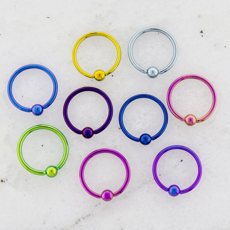 9 Color Titanium Captive Bead Ring Assortment – 1 Pack 14G (1.6mm) Inner Diameter: 1/2″ (12.7mm) | Ball-Size: 5mm