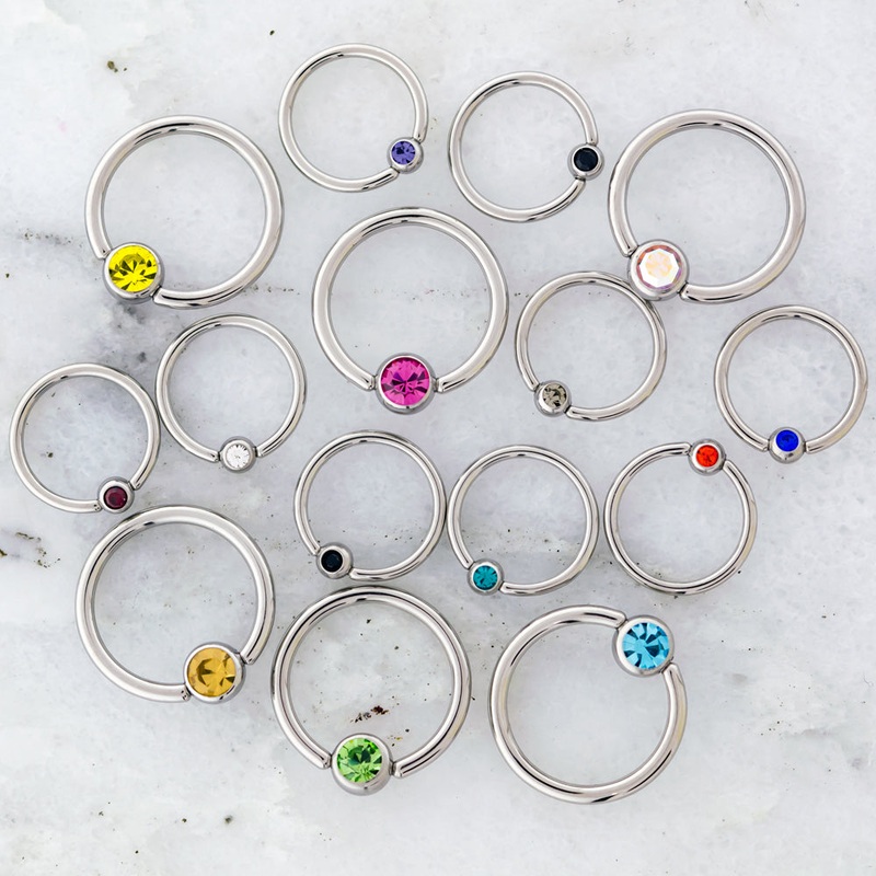 14G – 16G Steel Gem Captive Bead Rings 14G (1.6mm) 13mm (1/2″) / 5mm Sapphire